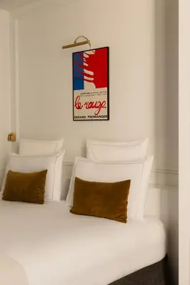 Un ou plusieurs lits dans un hébergement de l'établissement Hôtel Bourgogne & Montana
