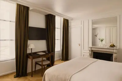 Un ou plusieurs lits dans un hébergement de l'établissement Hôtel Bourgogne & Montana