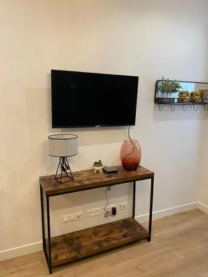 Télévision ou salle de divertissement dans l'établissement Alex's house