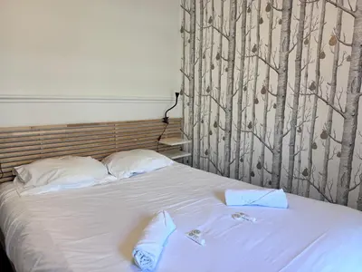 Un ou plusieurs lits dans un hébergement de l'établissement FELLINI 3BR with safe parking