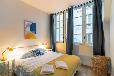 Un ou plusieurs lits dans un hébergement de l'établissement Lofts Philippe-Auguste