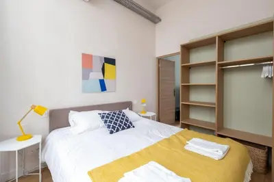 Un ou plusieurs lits dans un hébergement de l'établissement Lofts Philippe-Auguste