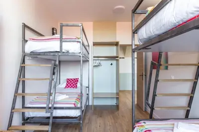 Un ou plusieurs lits dans un hébergement de l'établissement Lofts Philippe-Auguste