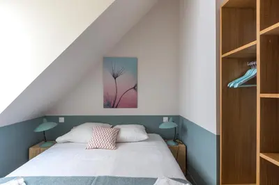 Un ou plusieurs lits dans un hébergement de l'établissement Lofts Philippe-Auguste