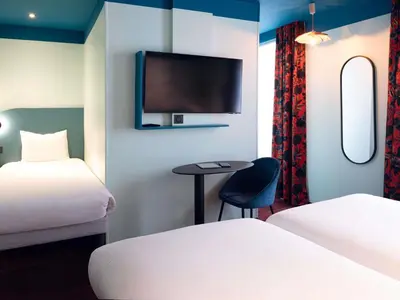 Un ou plusieurs lits dans un hébergement de l'établissement Ibis Styles Paris Batignolles