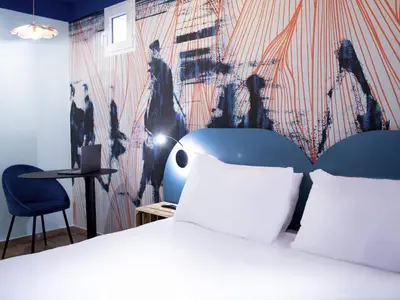 Un ou plusieurs lits dans un hébergement de l'établissement Ibis Styles Paris Batignolles