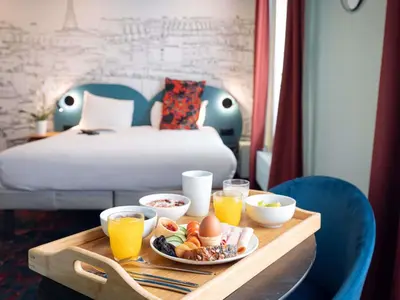 Un ou plusieurs lits dans un hébergement de l'établissement Ibis Styles Paris Batignolles
