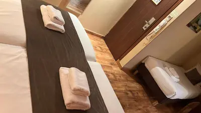 Un ou plusieurs lits dans un hébergement de l'établissement 121 Paris Hotel