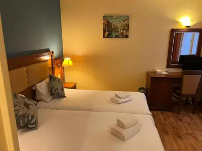 Un ou plusieurs lits dans un hébergement de l'établissement 121 Paris Hotel