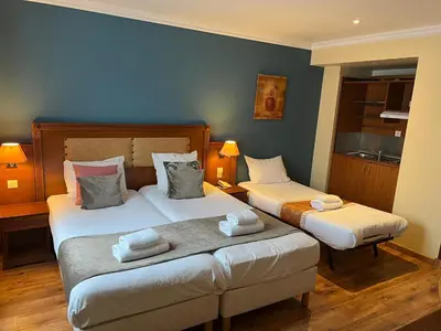 Un ou plusieurs lits dans un hébergement de l'établissement 121 Paris Hotel