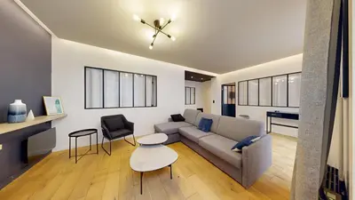 Coin salon dans l'établissement 140 Suite Ludo - Superbe Appartement à Paris