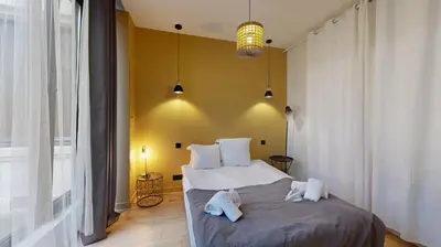 Un ou plusieurs lits dans un hébergement de l'établissement 140 Suite Ludo - Superbe Appartement à Paris