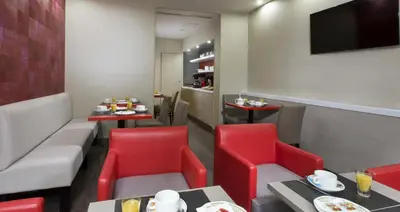 Coin salon dans l'établissement Hôtel des Pavillons