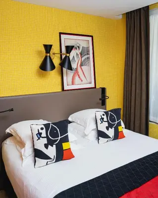 Un ou plusieurs lits dans un hébergement de l'établissement Hôtel Artus