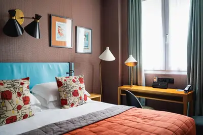 Un ou plusieurs lits dans un hébergement de l'établissement Hôtel Artus