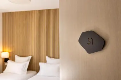 Un ou plusieurs lits dans un hébergement de l'établissement Hotel Korner Montparnasse