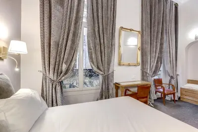 Un ou plusieurs lits dans un hébergement de l'établissement Hotel Opera Maintenon