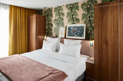 Un ou plusieurs lits dans un hébergement de l'établissement Hotel Taylor