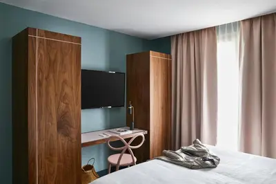 Un ou plusieurs lits dans un hébergement de l'établissement Hotel Taylor