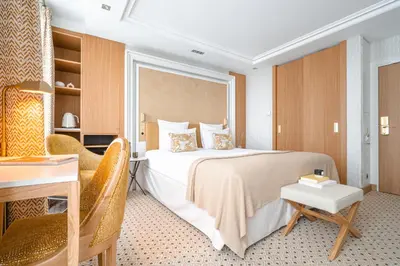 Un ou plusieurs lits dans un hébergement de l'établissement Hôtel Madison