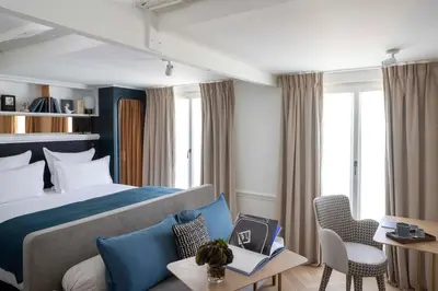 Un ou plusieurs lits dans un hébergement de l'établissement Hotel Louvre Montana
