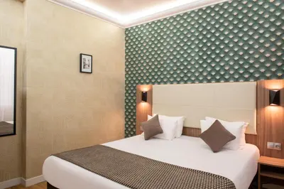 Un ou plusieurs lits dans un hébergement de l'établissement Hotel Cactus