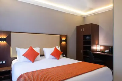 Un ou plusieurs lits dans un hébergement de l'établissement Hotel Cactus