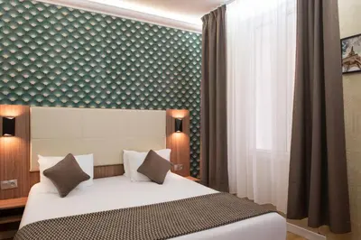 Un ou plusieurs lits dans un hébergement de l'établissement Hotel Cactus