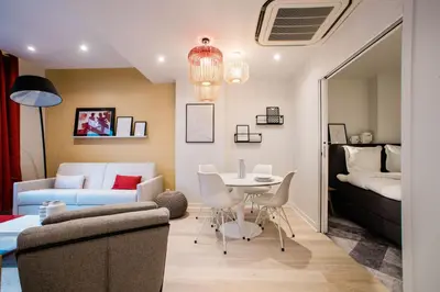 Coin salon dans l'établissement SUITE GIDE : au cœur de la Rive Gauche, neuf, design, 2/4 personnes