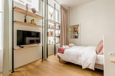 Un ou plusieurs lits dans un hébergement de l'établissement Appartement Panthéon - Feuillantines