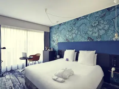Un ou plusieurs lits dans un hébergement de l'établissement Hôtel Relais de Lyon By Malone