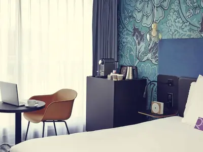 Un ou plusieurs lits dans un hébergement de l'établissement Hôtel Relais de Lyon By Malone