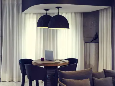 Coin salon dans l'établissement Hôtel Relais de Lyon By Malone