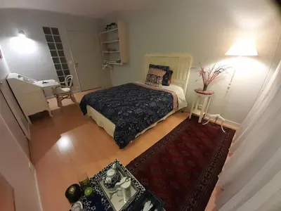 Un ou plusieurs lits dans un hébergement de l'établissement Homestay Rooms Paris Porte de Versailles