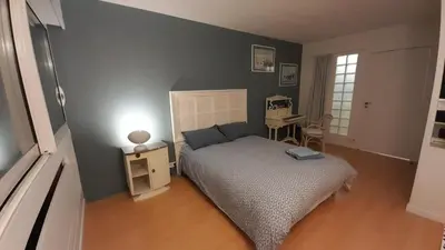Un ou plusieurs lits dans un hébergement de l'établissement Homestay Rooms Paris Porte de Versailles