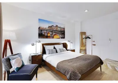 Un ou plusieurs lits dans un hébergement de l'établissement Apartments Paris Centre - At Home Hotel