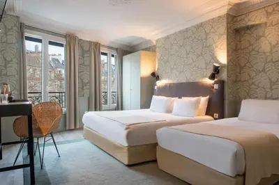 Un ou plusieurs lits dans un hébergement de l'établissement Hôtel Avama Prony