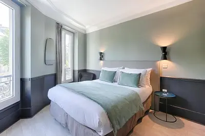 Un ou plusieurs lits dans un hébergement de l'établissement Hôtel Avama Prony