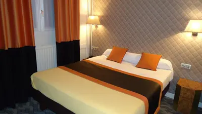 Un ou plusieurs lits dans un hébergement de l'établissement Hotel d'Amiens