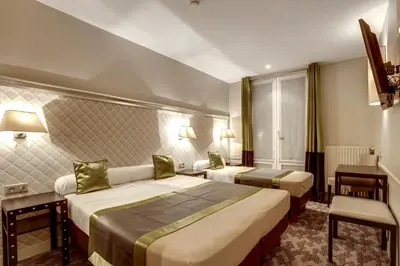 Un ou plusieurs lits dans un hébergement de l'établissement Hotel d'Amiens