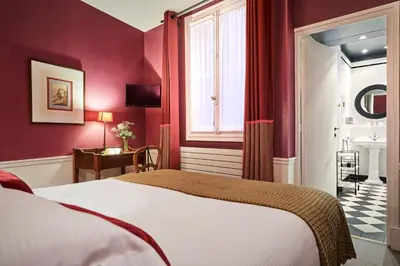 Un ou plusieurs lits dans un hébergement de l'établissement Hôtel Sainte-Beuve