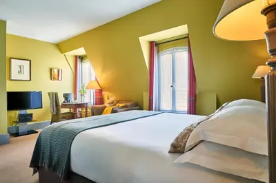 Un ou plusieurs lits dans un hébergement de l'établissement Hôtel Sainte-Beuve