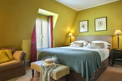 Un ou plusieurs lits dans un hébergement de l'établissement Hôtel Sainte-Beuve