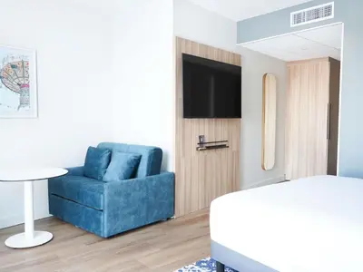 Télévision ou salle de divertissement dans l'établissement AppartHotel Mercure Paris Boulogne