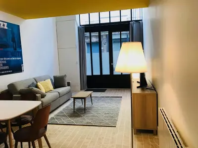 Coin salon dans l'établissement Hôtel Villa Blomet