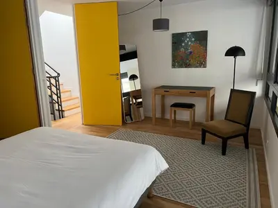 Un ou plusieurs lits dans un hébergement de l'établissement Hôtel Villa Blomet
