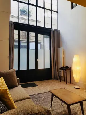 Coin salon dans l'établissement Hôtel Villa Blomet