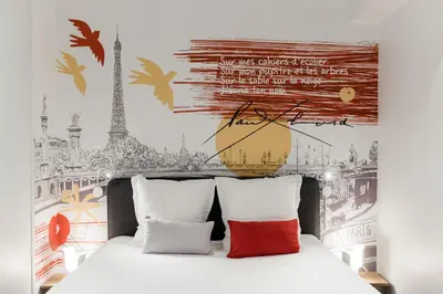 Un ou plusieurs lits dans un hébergement de l'établissement SUITE ELUARD au cœur de la Rive Gauche, neuf, design, 2-4 personnes