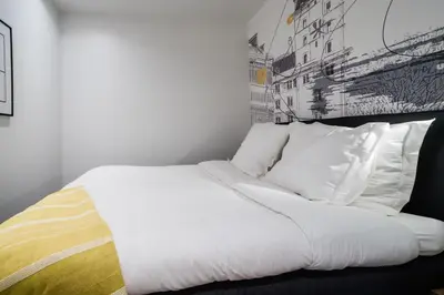 Un ou plusieurs lits dans un hébergement de l'établissement SUITE DESNOS : au cœur de la Rive Gauche, neuf, design, 2 personnes