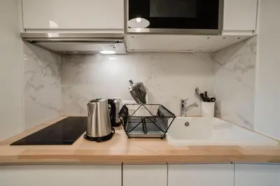 Cuisine ou kitchenette dans l'établissement SUITE DESNOS : au cœur de la Rive Gauche, neuf, design, 2 personnes